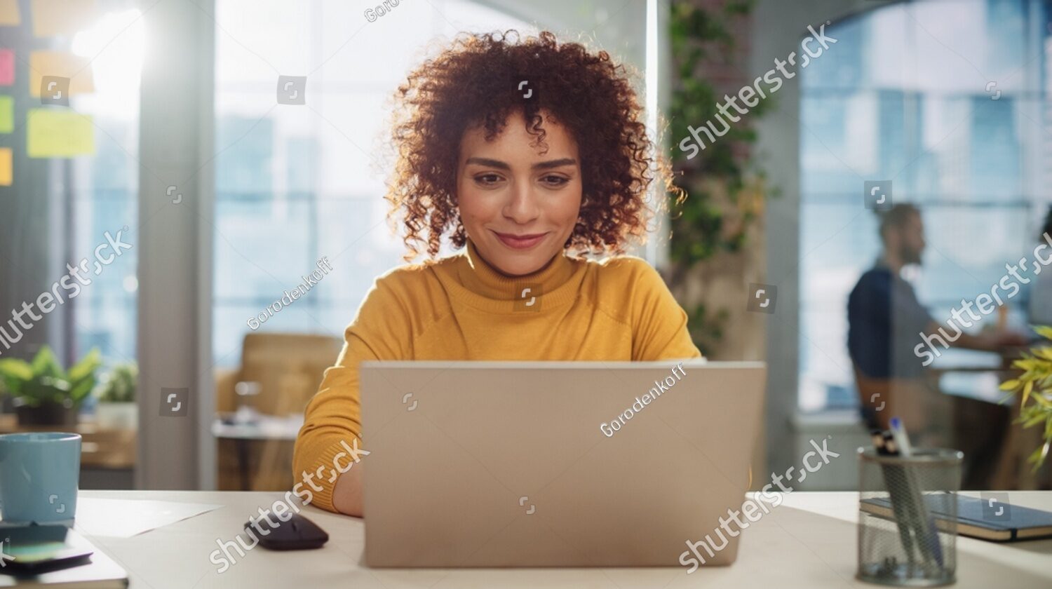 stock-photo-beautiful-middle-eastern-manager-sitting-at-a-desk-in-creative-office-young-stylish-female-with-2231710273