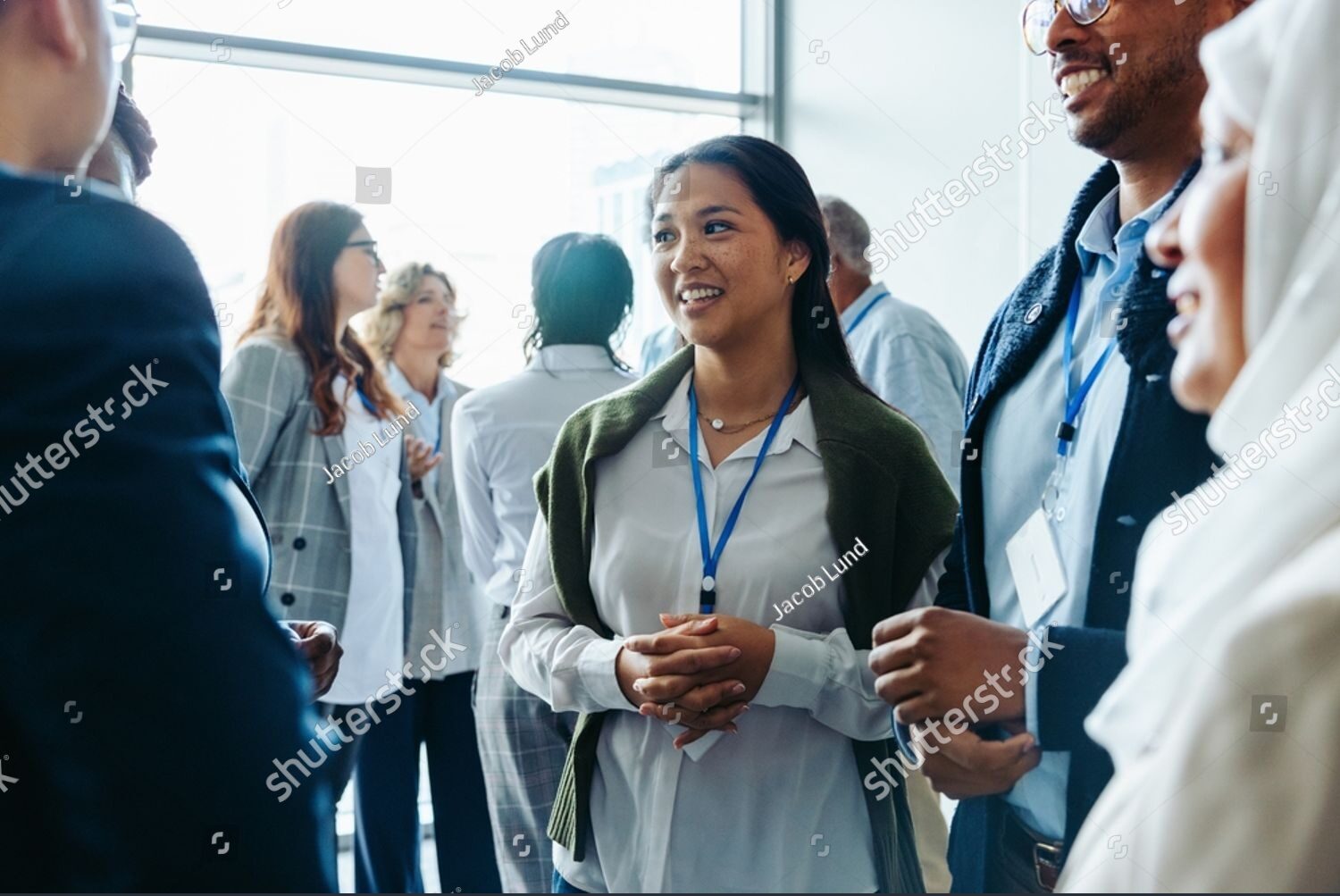 stock-photo-group-of-diverse-business-professionals-businessmen-and-businesswomen-networking-at-a-conference-2496616647